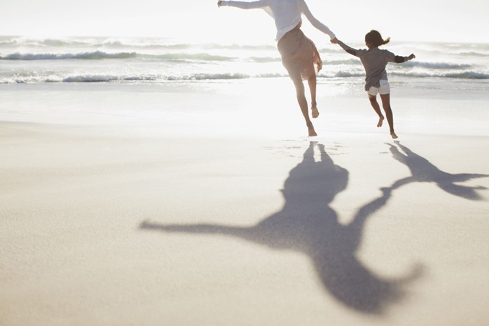 People jumping on a beach